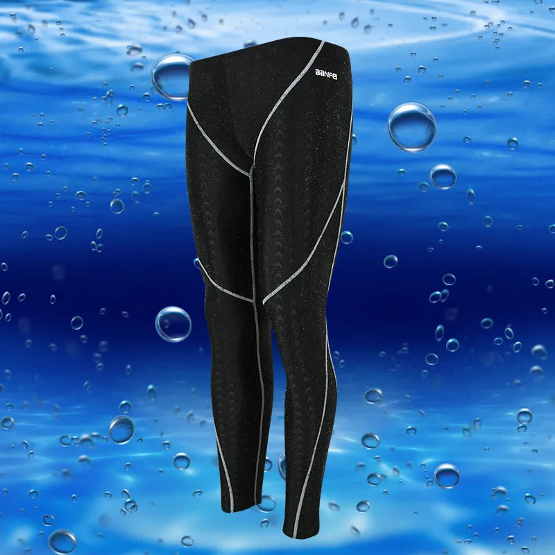 Men's black nylon cropped swimming trunks with a grey contrast stripe and internal mesh lining.