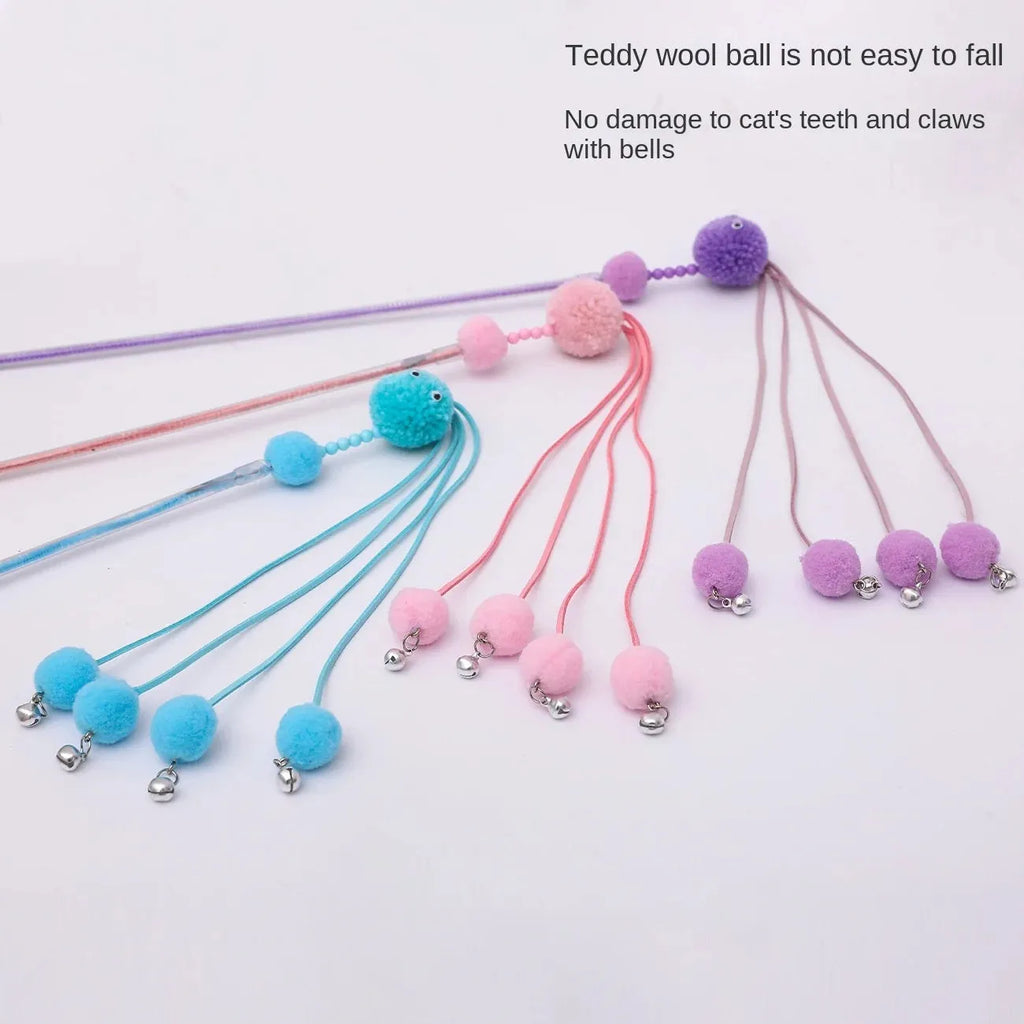 Pipitao funny cat stick toy with blue tassel on a carpet for pet play