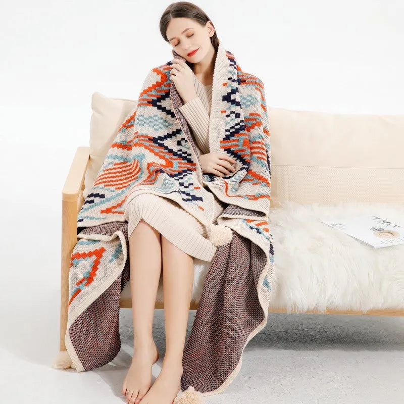 Bohemian style acrylic sofa throw blanket with tassel trim in a geometric pattern colour