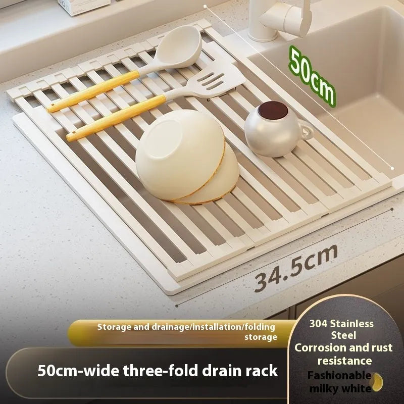 Milky white foldable stainless steel kitchen draining rack placed next to a sink.