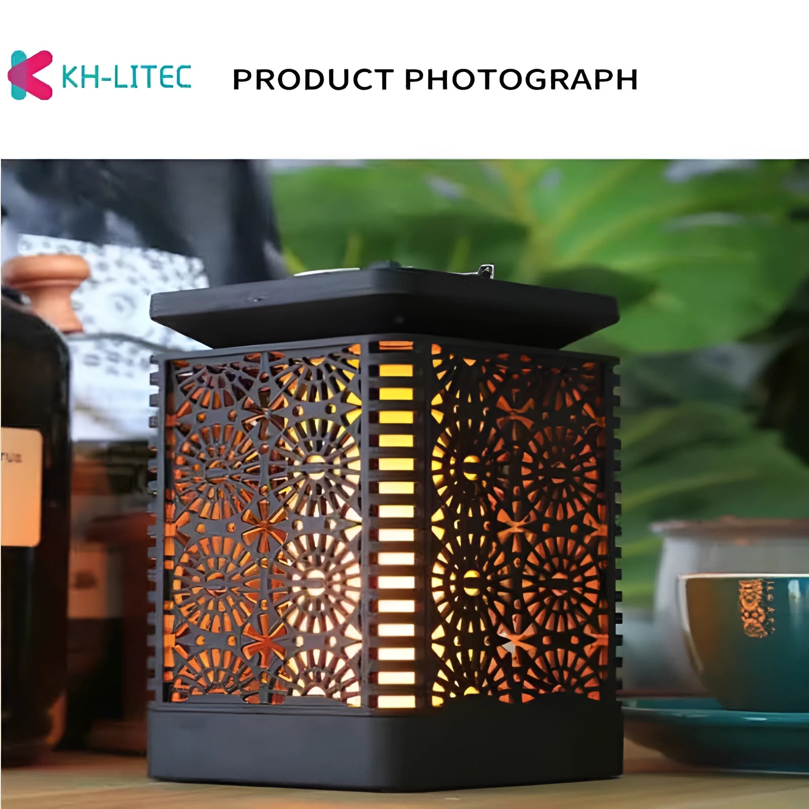Set of four black solar flame torch lights with flickering LED effect for garden decoration
