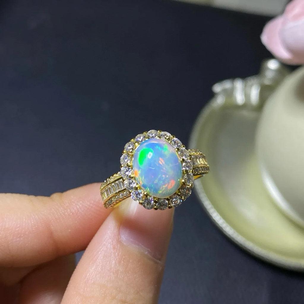 Handmade natural opal silver ring in gold colour with adjustable opening on hand
