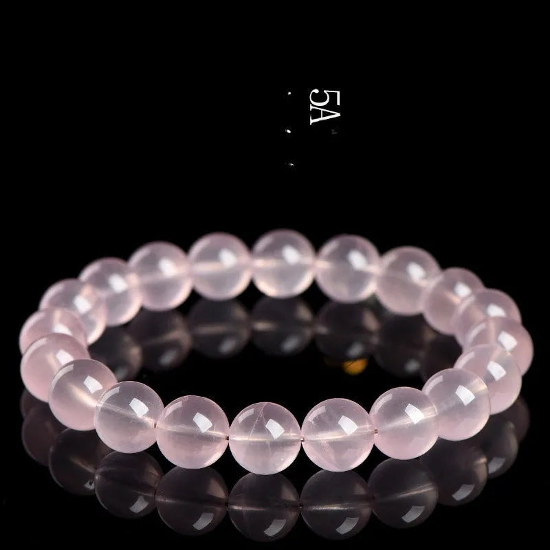 Natural starlight crystal round bead bracelet with polished finish in pink colour options