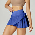 Women's solid colour quick-dry sports shorts in Klein blue on a white background.