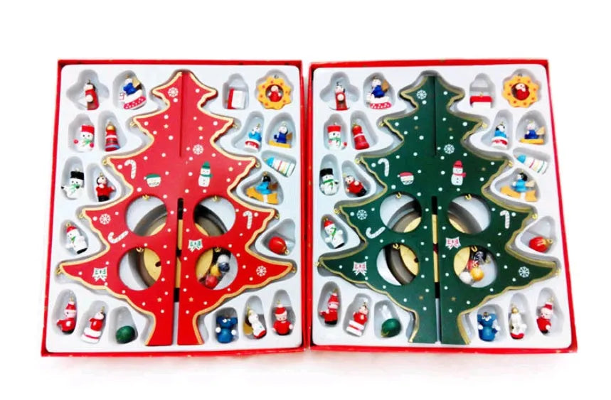 Set of three hand-painted wooden Christmas trees in green and red, 36cm tall, on a table