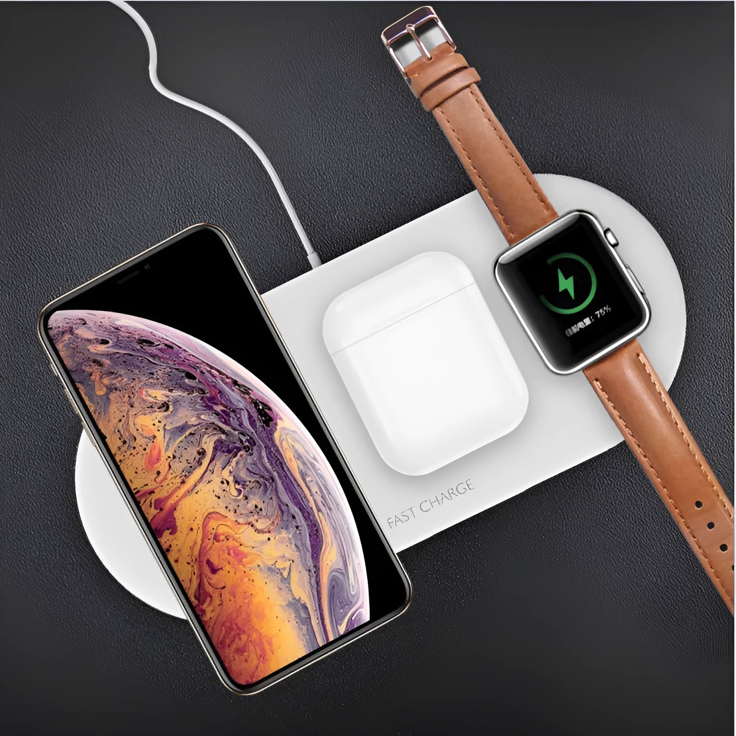 White three-in-one wireless charging station for Apple Watch, iPhone, and earbuds on a desk.