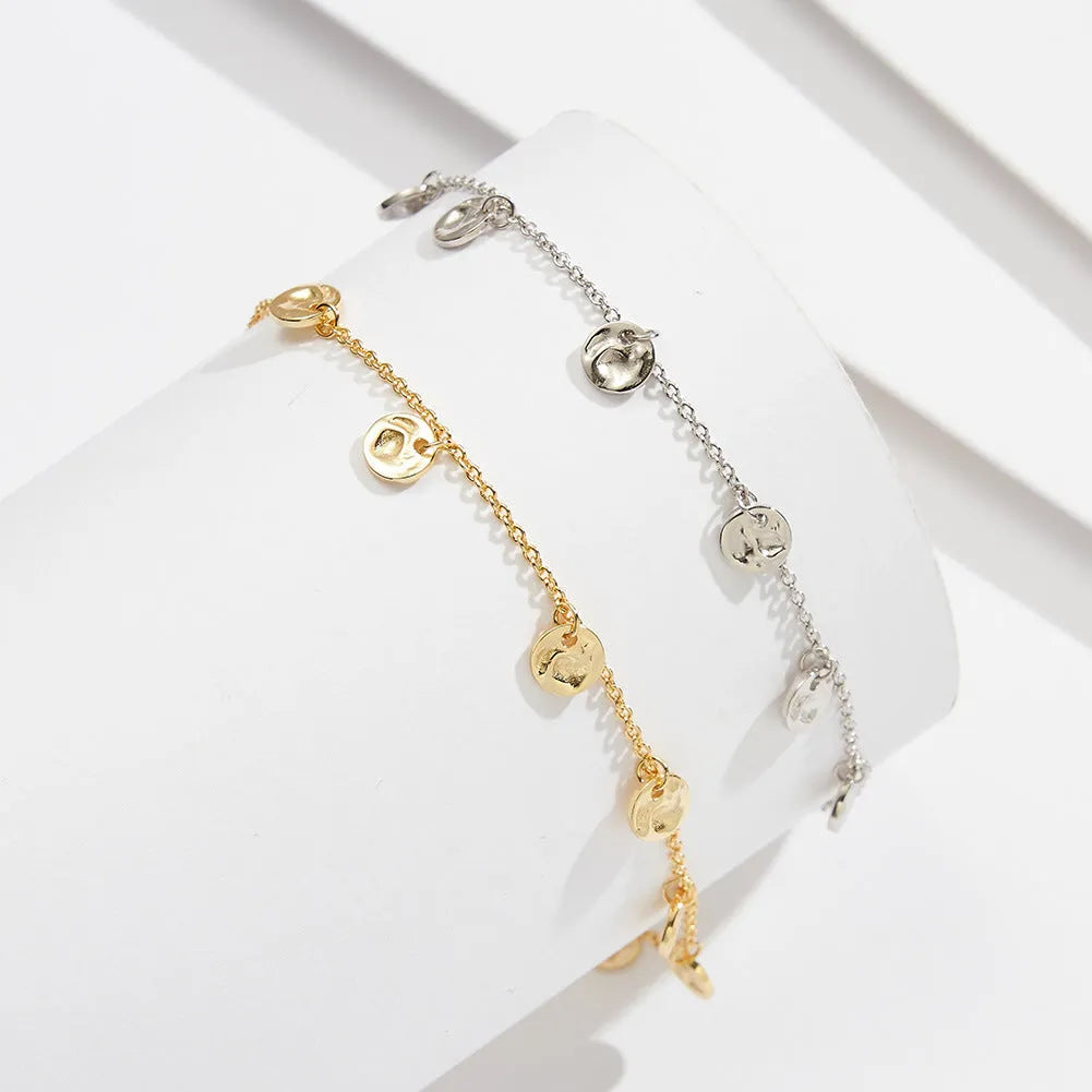 S925 silver round anklet in Han style, 14K gold finish, on model ankle