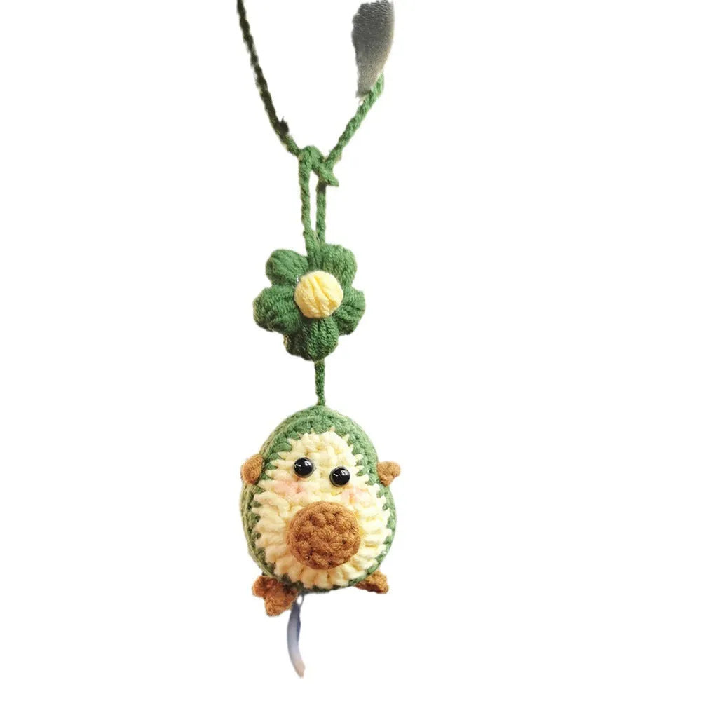 Handmade wool crocheted car pendant in avocado, pink rainbow, and red rainbow colour options