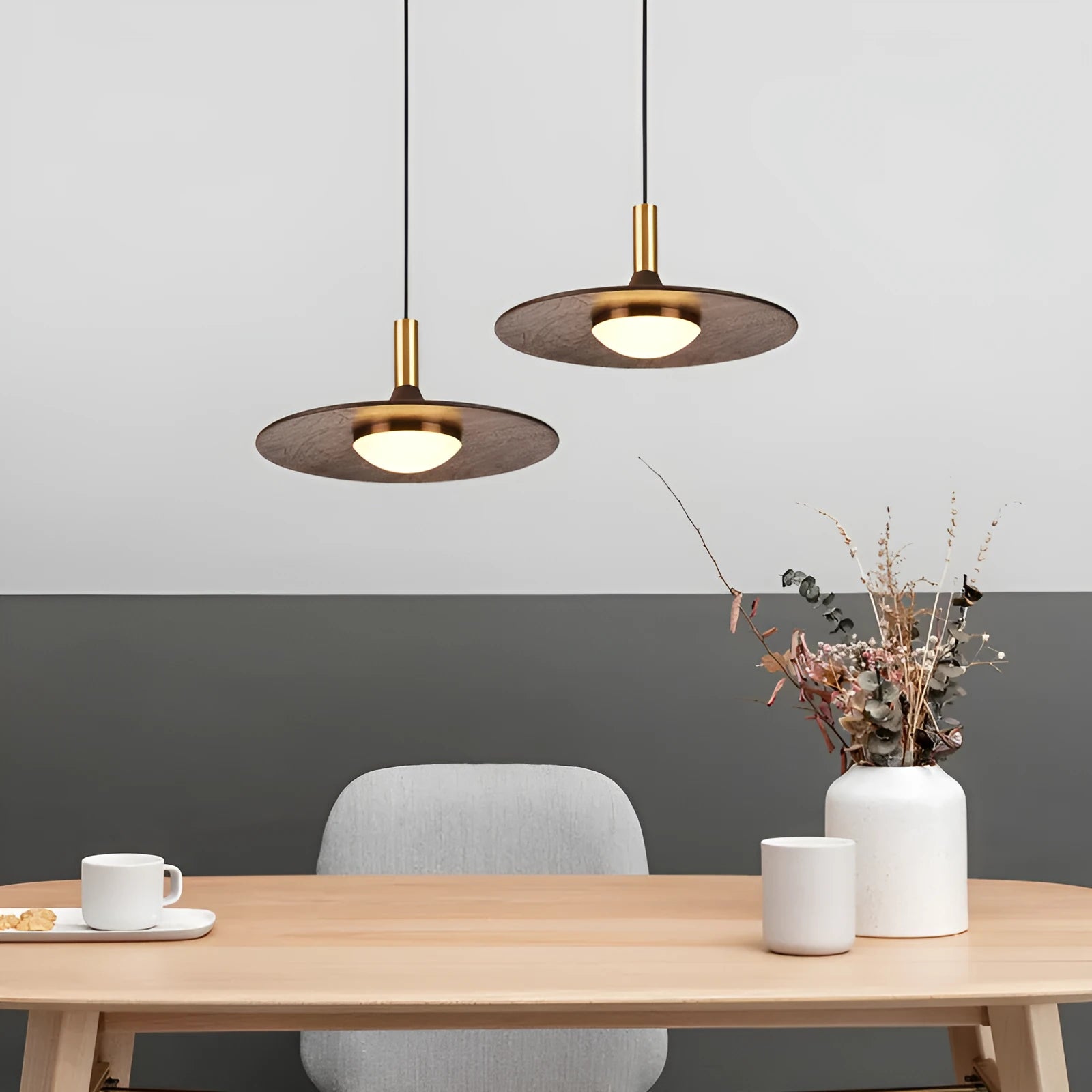 Walnut wood fish line chandelier with all-copper accents against a light background
