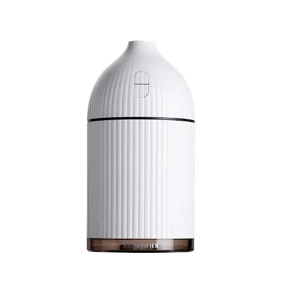 White ultrasonic aromatherapy diffuser with LED lights showing water mist emission