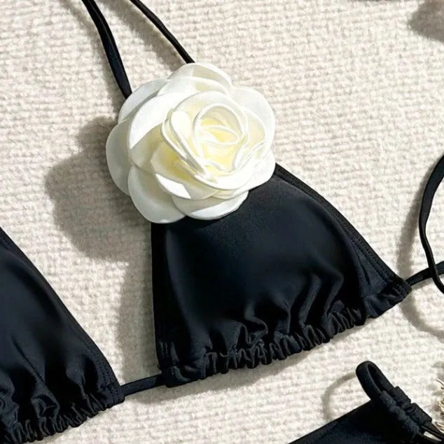 Black 3D flower lace drawstring bikini swimsuit with backless top and shorts on a model