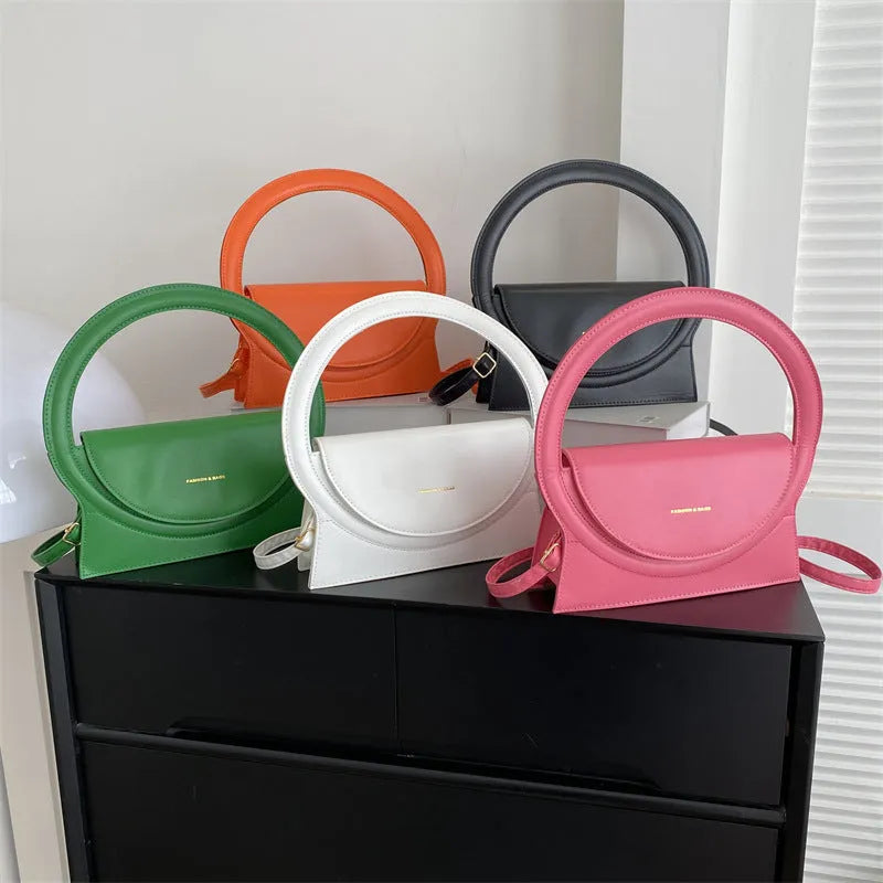 PU leather messenger bag in horizontal square shape with phone compartment and stitching detail