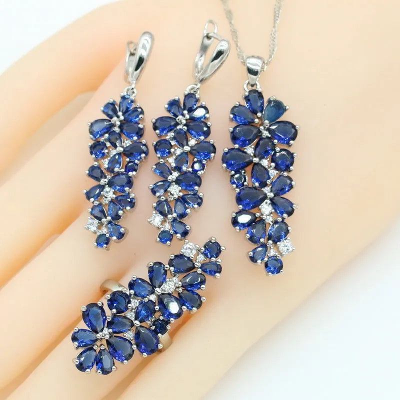 Dark blue copper inlaid zircon retro jewellery set including necklace, earrings, ring, and bracelet on display
