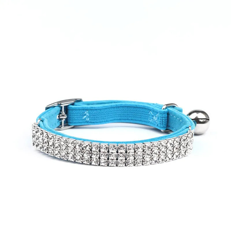 Rhinestone-decorated velvet cat collar shown in red, adjustable from 20 to 30 cm.