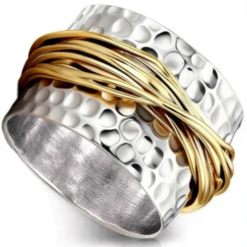 Alloy two-tone ring with hammered metal coil design, electroplated finish, on white background