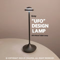 Modern UFO-shaped metal desk lamp with touch-sensitive base in black, gold, or grey finish.