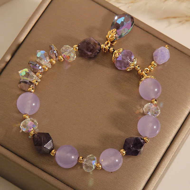 Lavender purple crystal water drop bracelet for children on display, retro original design