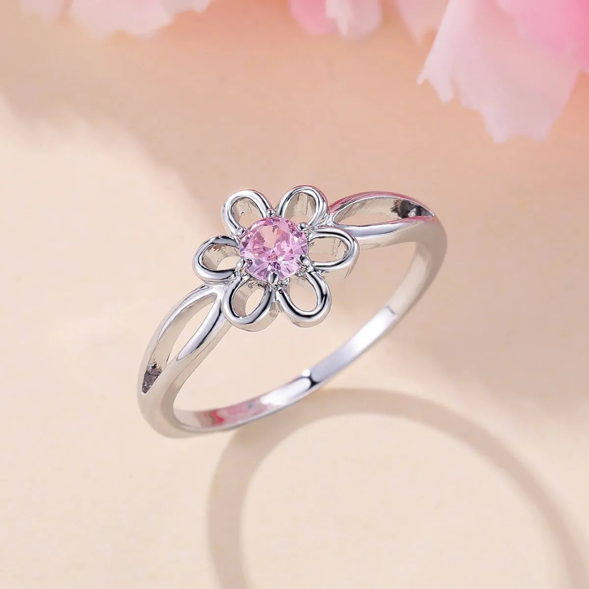 Lady's flower hollowed fashion simple ring in copper with platinum pink diamond electroplated finish