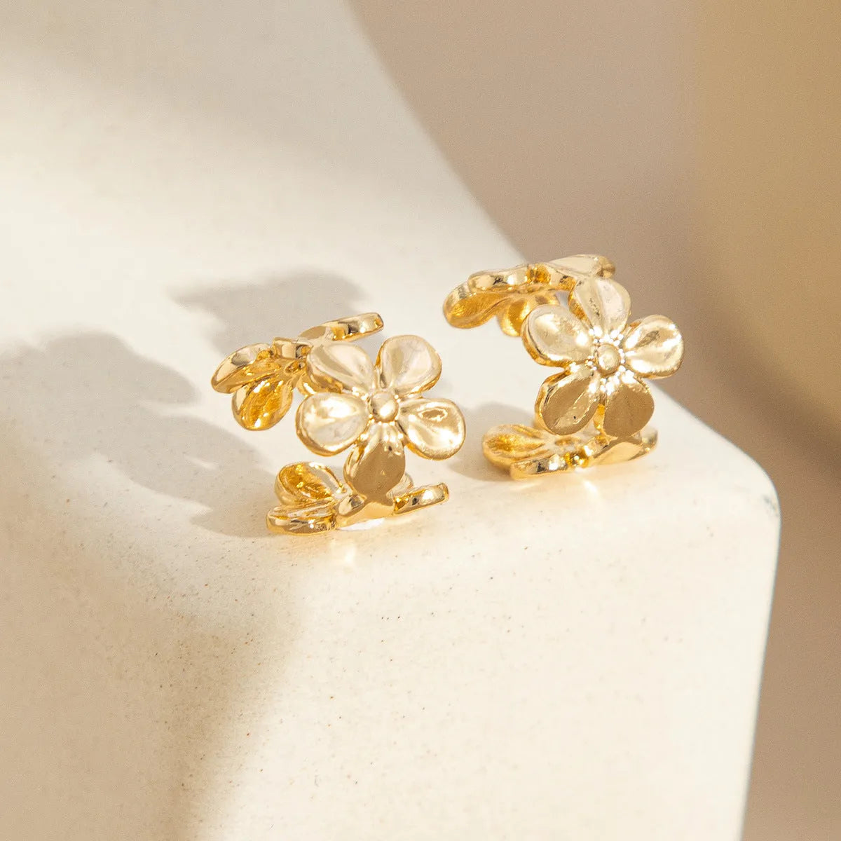 Gold starfish and conch shell earrings for women with animal zodiac designs