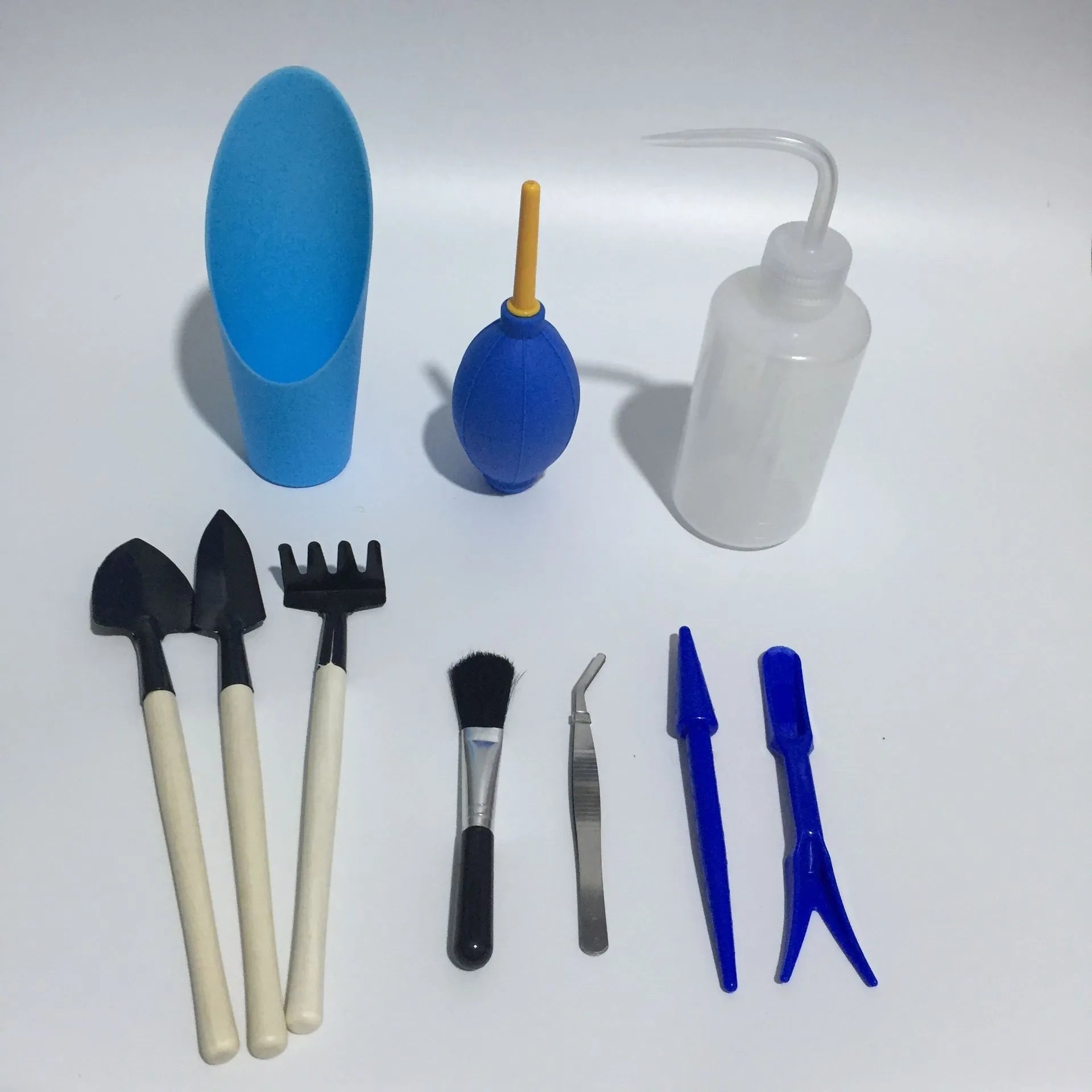Succulent gardening tool set with watering can, small shovels, tweezers, and brush for indoor plants
