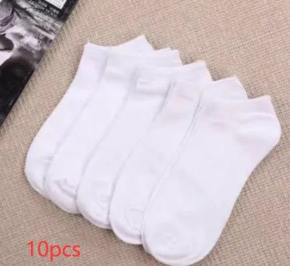 Black, white, and grey boat socks and medium tube socks from Degner in cotton blend fabric