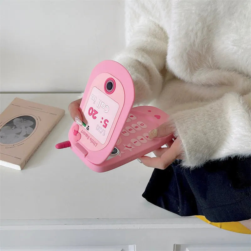 Light pink silicone flip phone case for iPhone with a built-in mirror on the front.