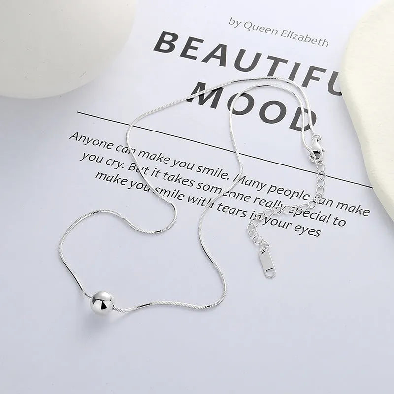 925 sterling silver clavicle chain necklace with round ball pendant on woman's neck
