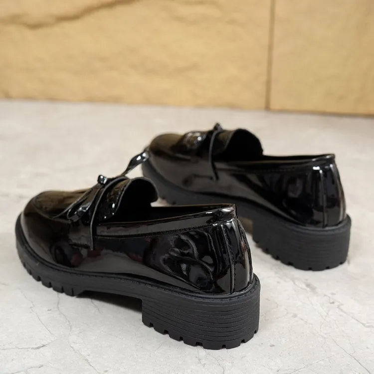 Women's brown loafer shoes with decorative bow detail on synthetic PU upper