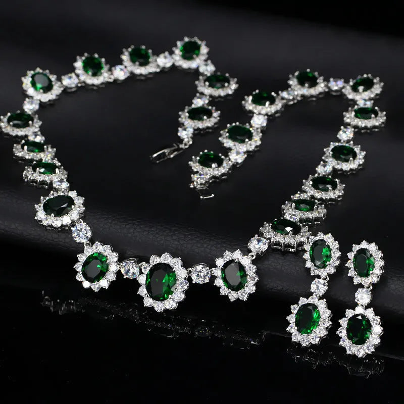 Two AAA jewellery sets with necklace and earrings in blue green red and white