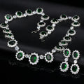 Two AAA jewellery sets with necklace and earrings in blue green red and white