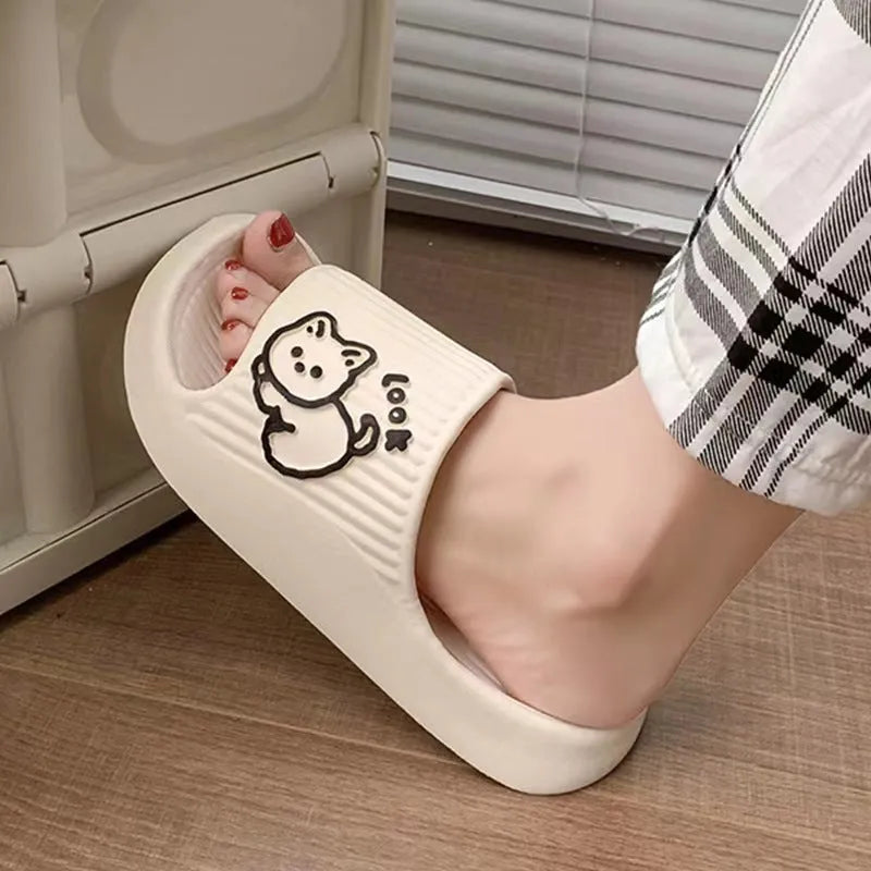 Green EVA platform slippers with a cat design on the upper, showing the thick non-slip sole.