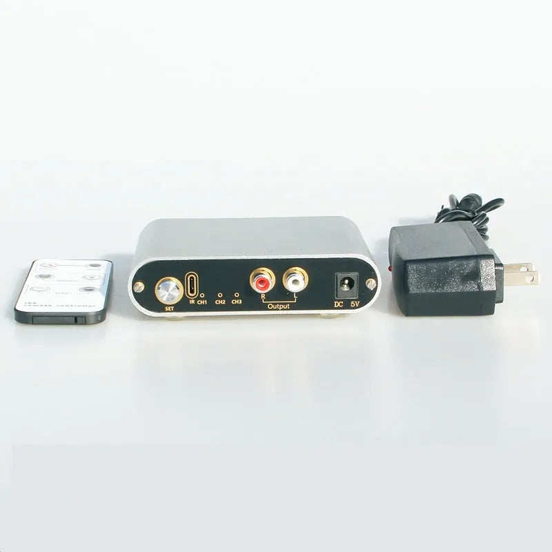 Silver audio source switch with infrared remote control and key switch on front panel, aluminium housing