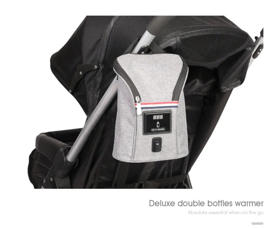 Grey Oxford cloth portable car USB baby bottle warmer showing electronic temperature display and hanging buckle.