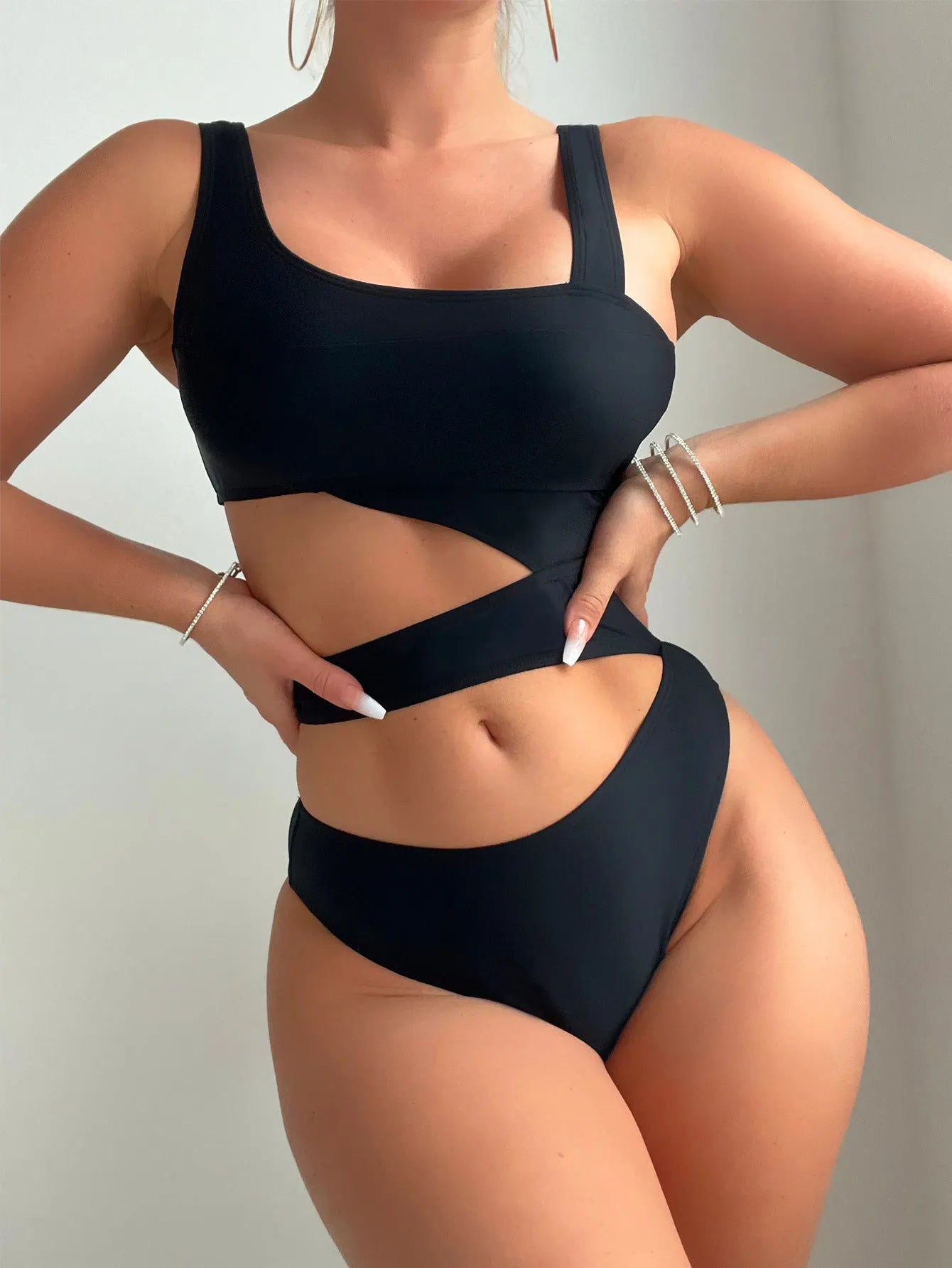 Black solid colour high cut hollow detail one-piece swimsuit for adult women