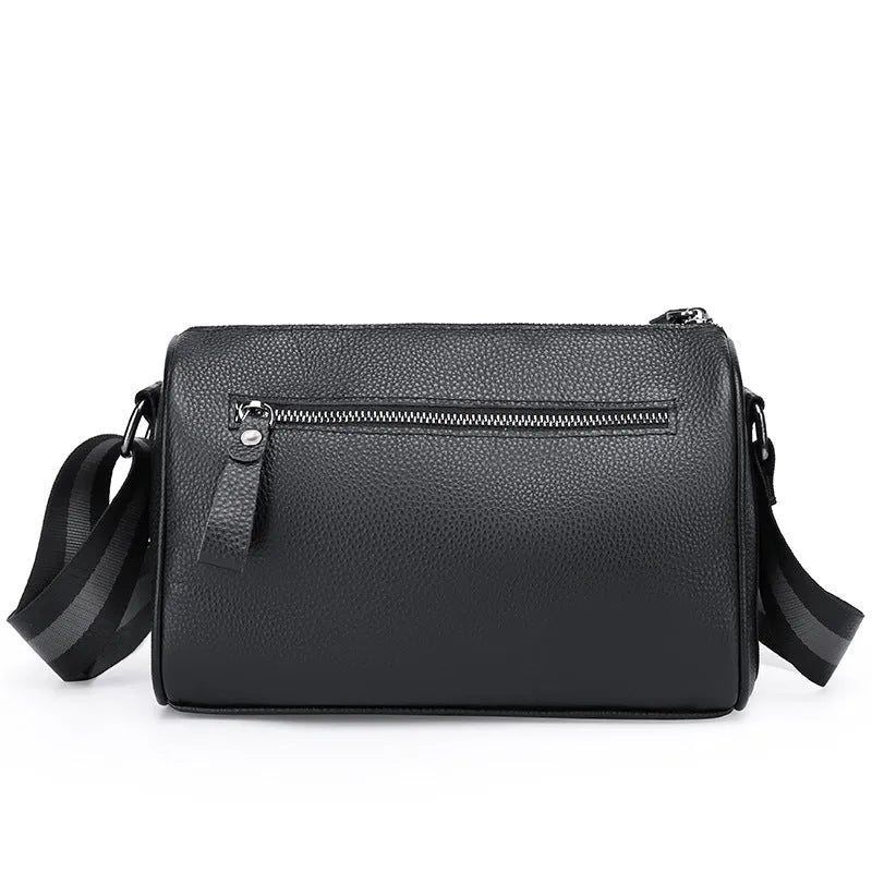 Black genuine leather one-shoulder crossbody bag showing front and strap.