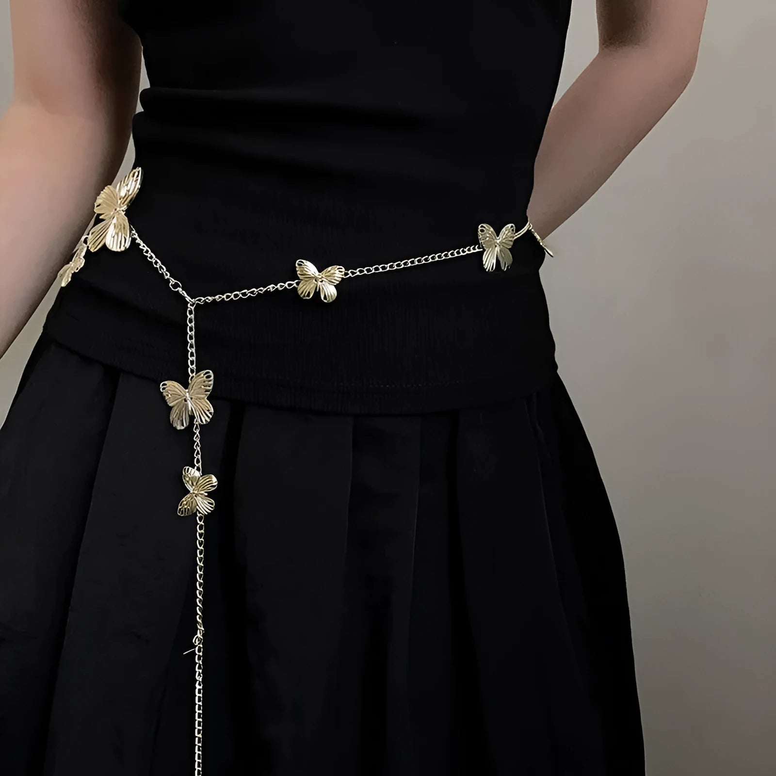 Golden butterfly alloy waist chain showing 104cm length and 40cm width measurement