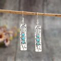 Silver geometric long drop earrings with turquoise inlay on a retro-style zinc alloy setting.