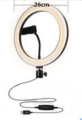 Aluminium adjustable live phone stand with tripod base extended to full height on a desk.