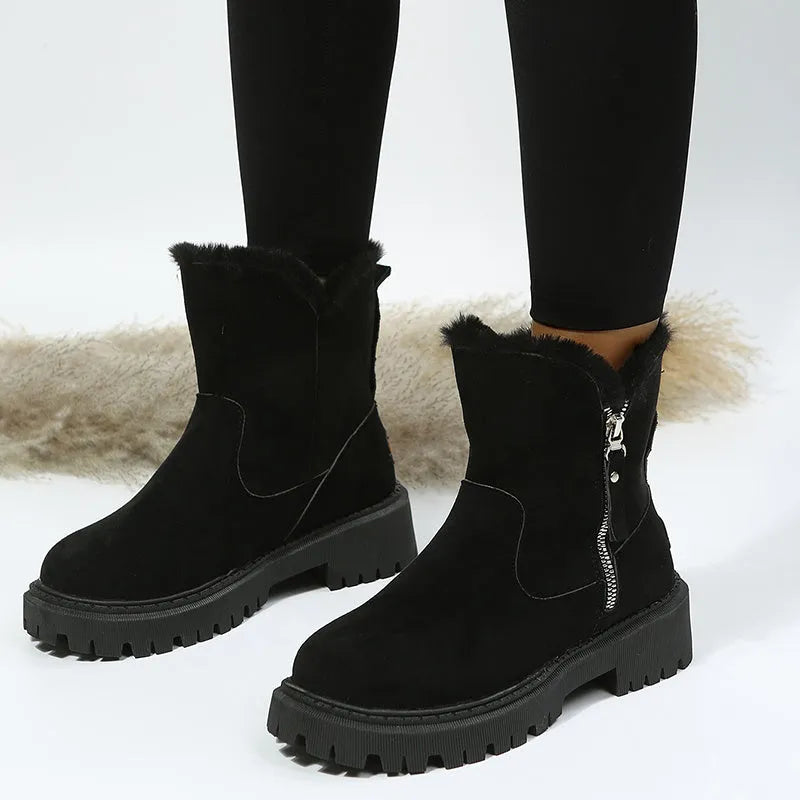 Women's black high-top snow boots with faux suede upper, side zipper, and thick plush lining.