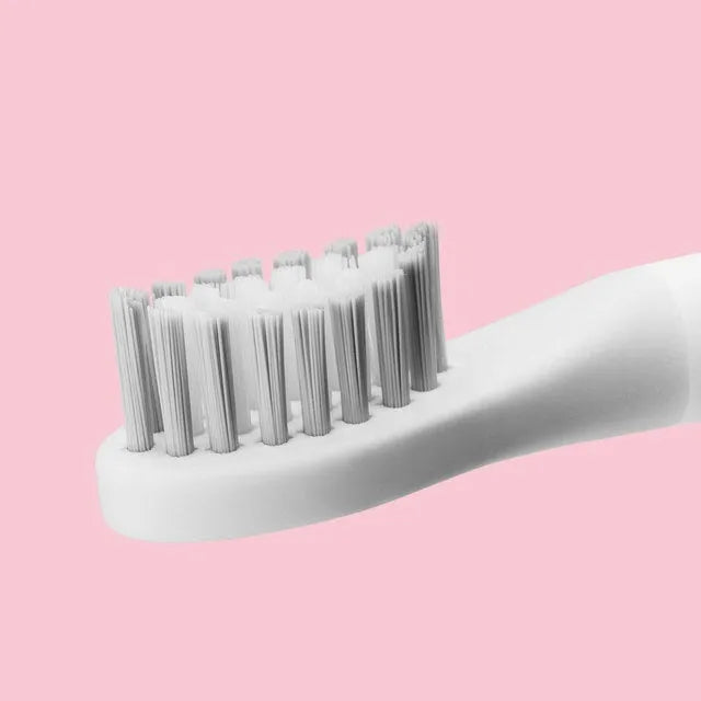 Sonic electric toothbrush in blue with round brushing head and IPX7 waterproof rating
