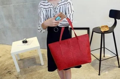 A simple fashion shoulder bag and handbag for spring summer, shown in black and grey colour options.
