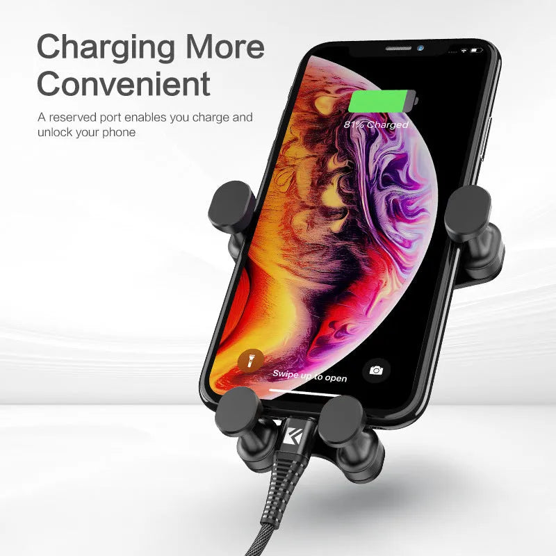 Black gravity car phone holder with 360 rotation mounted on air vent, holding a smartphone