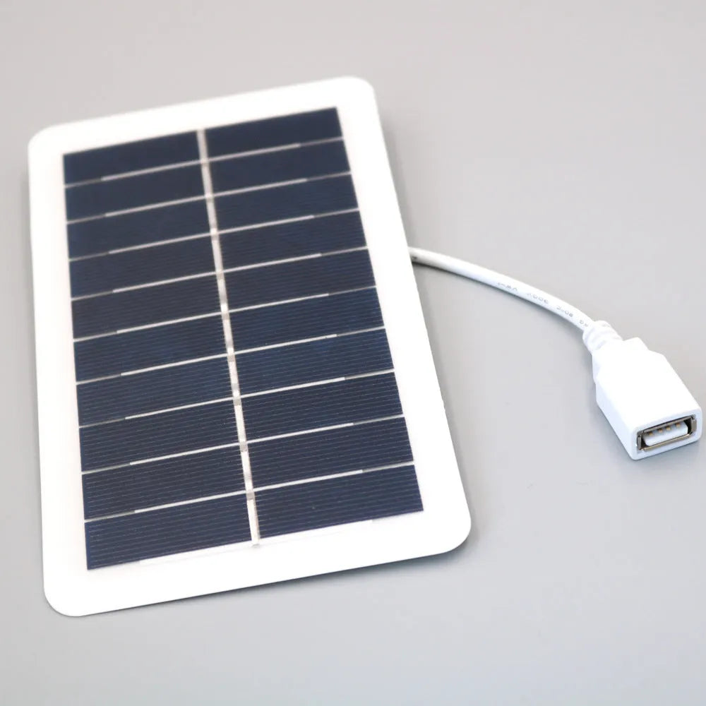 Portable black solar panel mobile phone charger with USB output and PET surface