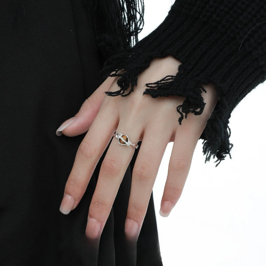 Saturn-inspired adjustable open ring with white gold electroplated finish and silver base
