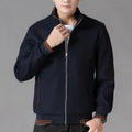 Men's grey wool fleece autumn jacket with long sleeves and a stick pocket, laid flat.