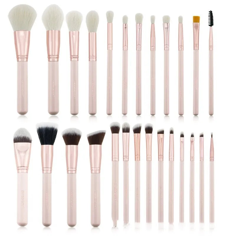 26 pink makeup brushes with wooden handles displayed in a open pink PU travel case