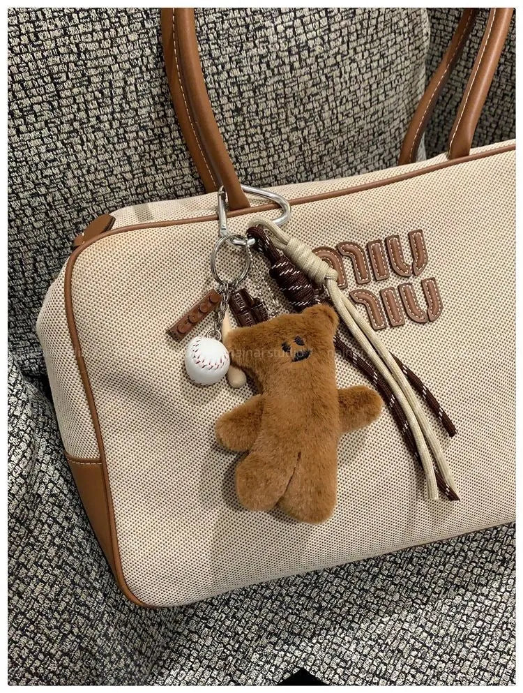 Plush brown bear doll pendant on a bag charm with soft fabric and small size