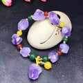 Natural shaped amethyst bead bracelet for women with a fu character charm.