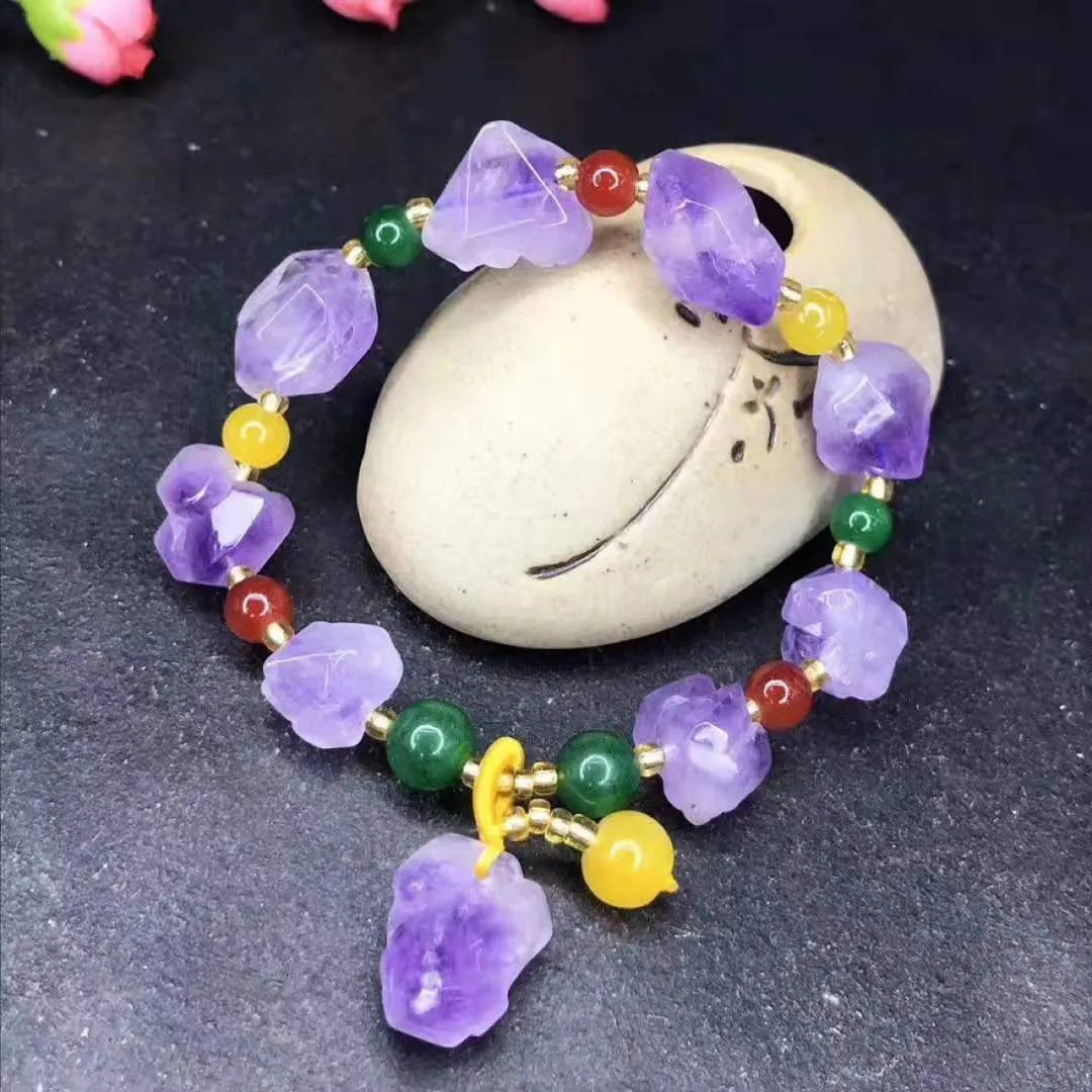 Natural shaped amethyst bead bracelet for women with a fu character charm.