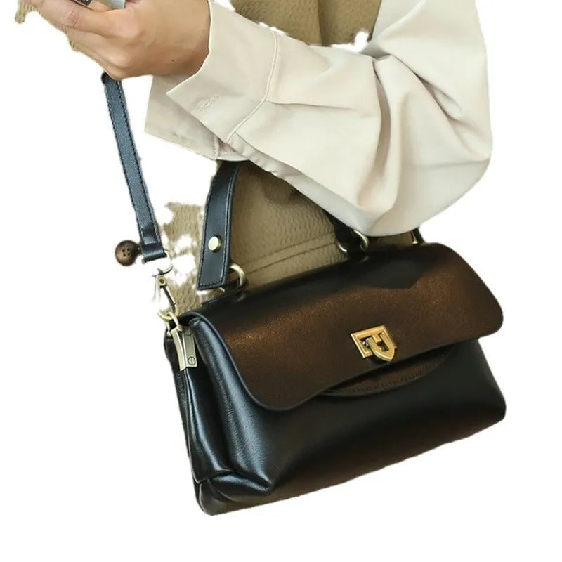Women's retro genuine leather handbag in saddle shape, first layer cowhide, five colours including dark brown and black